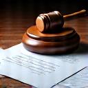 Gavel and legal documents on a table, symbolizing regulatory compliance and legal protection.